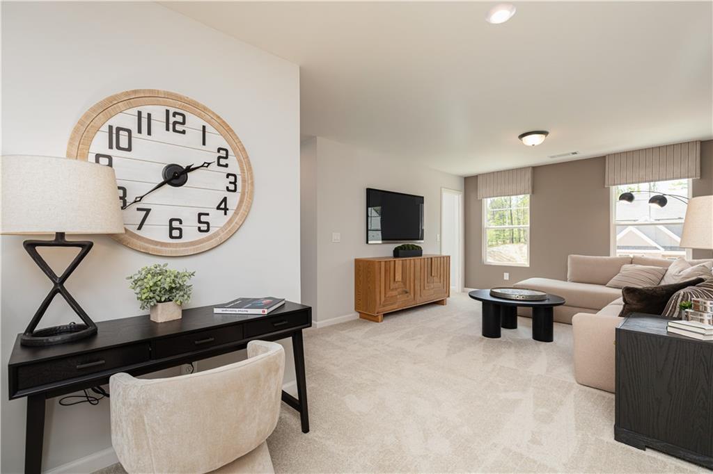 3260 Croftside Commons Powder Springs, GA 30127 - Photo 24 of 64 a living room with furniture and a window