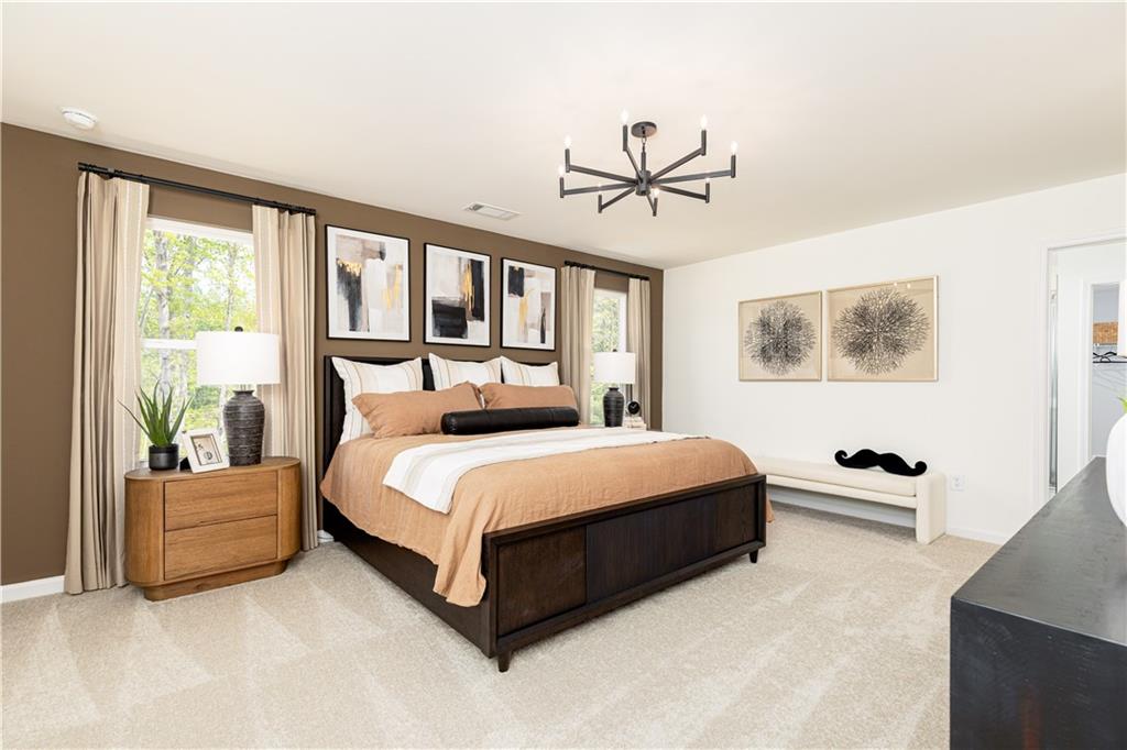 3260 Croftside Commons Powder Springs, GA 30127 - Photo 27 of 64 a bedroom with a large bed and a window