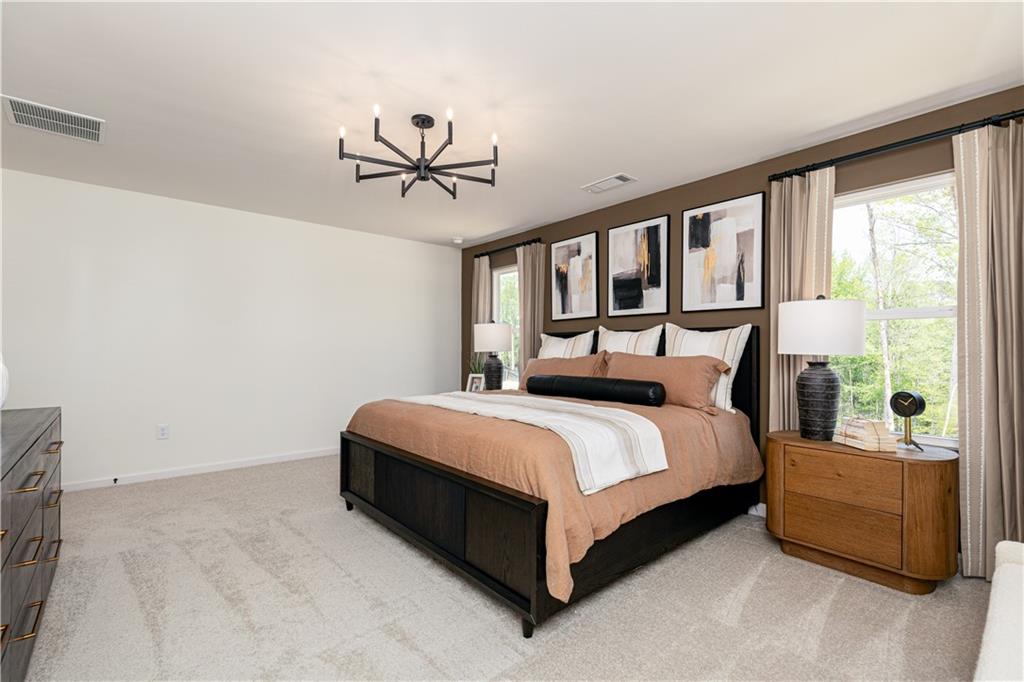 3260 Croftside Commons Powder Springs, GA 30127 - Photo 28 of 64 a bed sitting in a bedroom next to a window