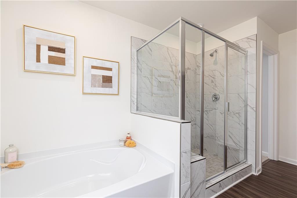 3260 Croftside Commons Powder Springs, GA 30127 - Photo 32 of 64 a bathroom with a bathtub and a shower