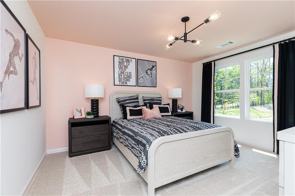 3260 Croftside Commons Powder Springs, GA 30127 - Photo 35 of 64 a bedroom with a large bed and a window