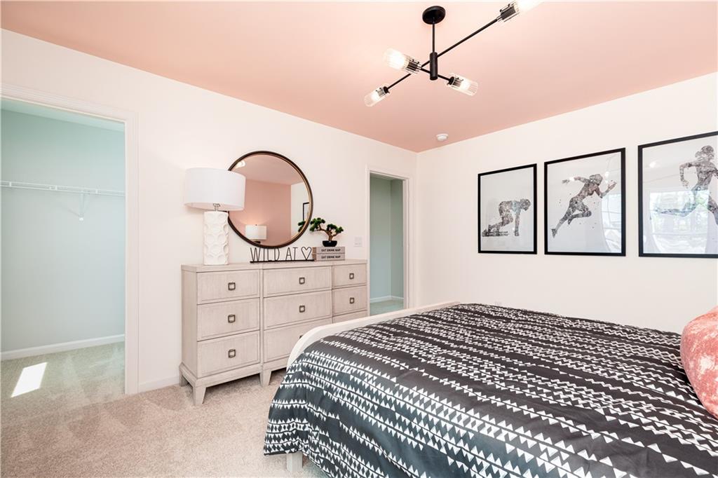 3260 Croftside Commons Powder Springs, GA 30127 - Photo 36 of 64 a bedroom with a bed and a dresser