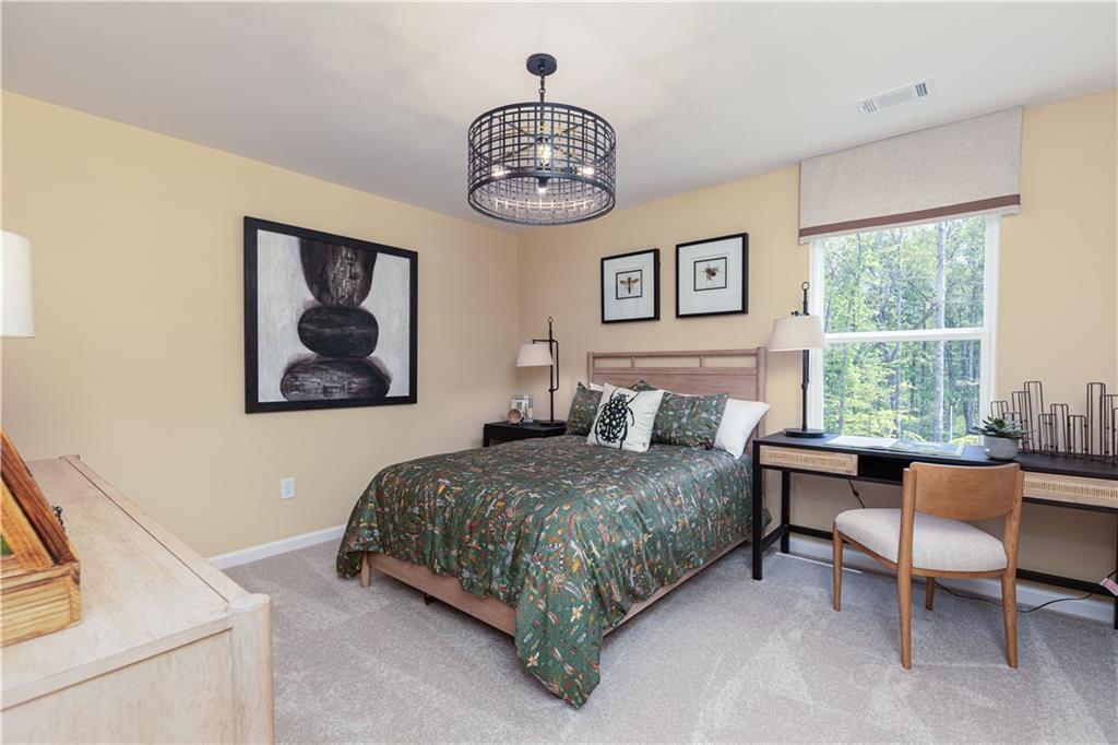 3260 Croftside Commons Powder Springs, GA 30127 - Photo 38 of 64 a bedroom with a bed and a window