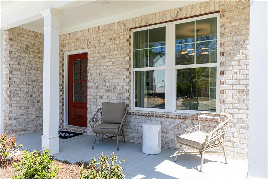 3260 Croftside Commons Powder Springs, GA 30127 - Photo 4 of 64 a building outdoor space with patio furniture and potted plants