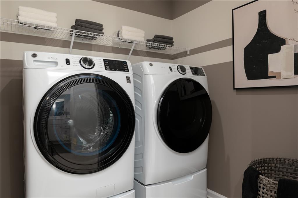 3260 Croftside Commons Powder Springs, GA 30127 - Photo 41 of 64 a utility room with dryer and washer