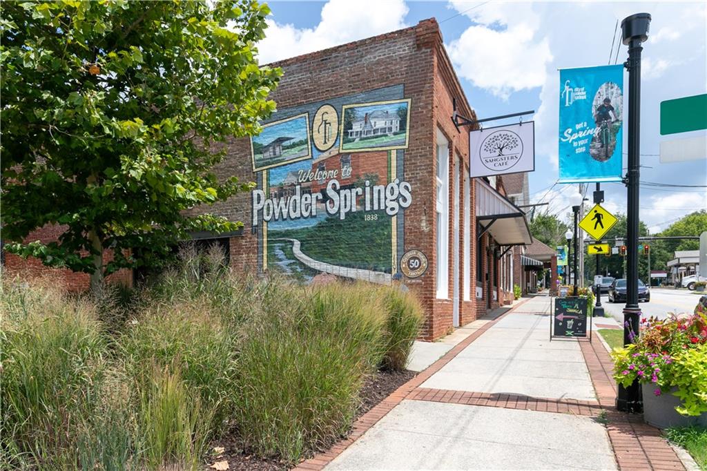 3260 Croftside Commons Powder Springs, GA 30127 - Photo 49 of 64 a sign board with buildings in the background