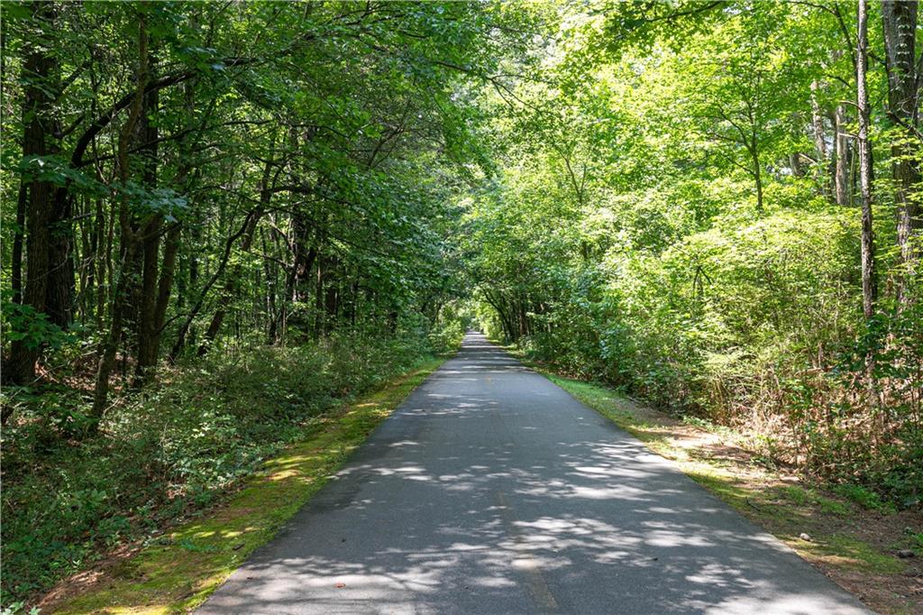 3260 Croftside Commons Powder Springs, GA 30127 - Photo 58 of 64 a view of a street with a trees