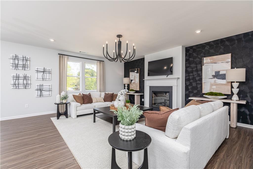 3260 Croftside Commons Powder Springs, GA 30127 - Photo 8 of 64 a living room with furniture a fireplace and a flat screen tv