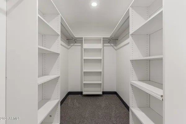 a view of an empty walk in closet