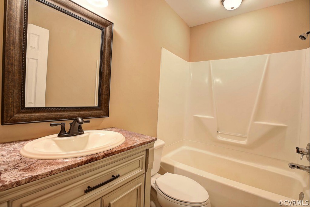 6600 Rock Run Road Chesterfield, VA 23832 - Photo 16 of 24 a bathroom with a granite countertop sink toilet and shower
