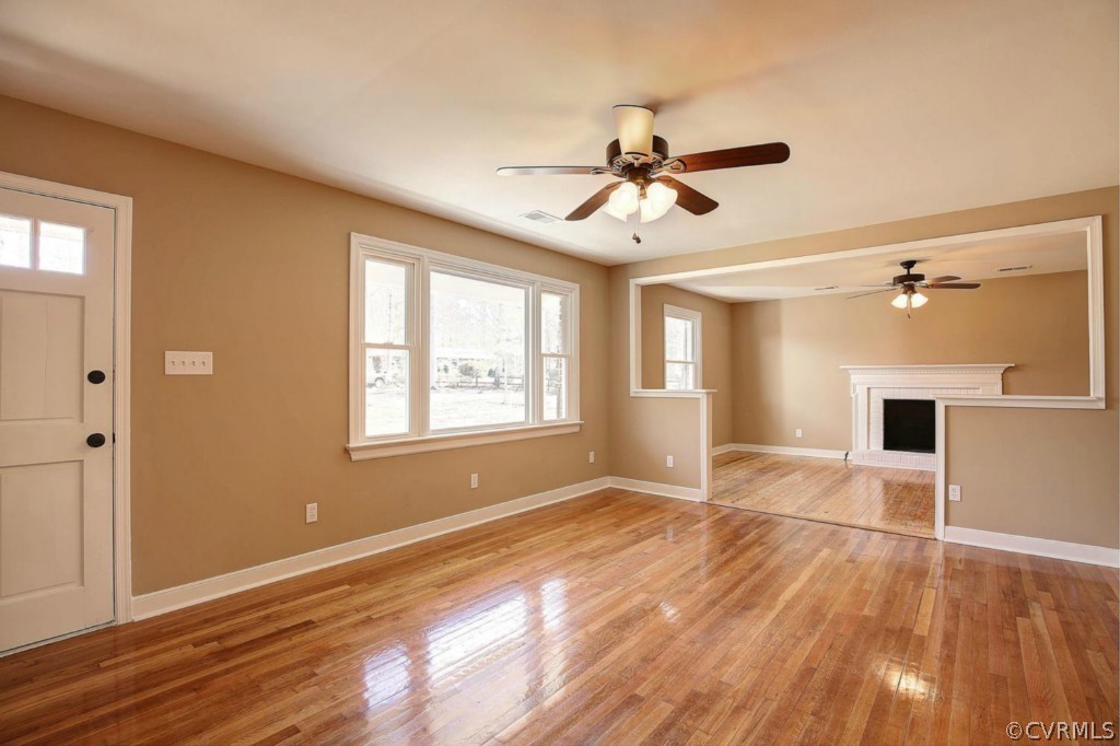 6600 Rock Run Road Chesterfield, VA 23832 - Photo 3 of 24 a view of empty room with wooden floor and fan