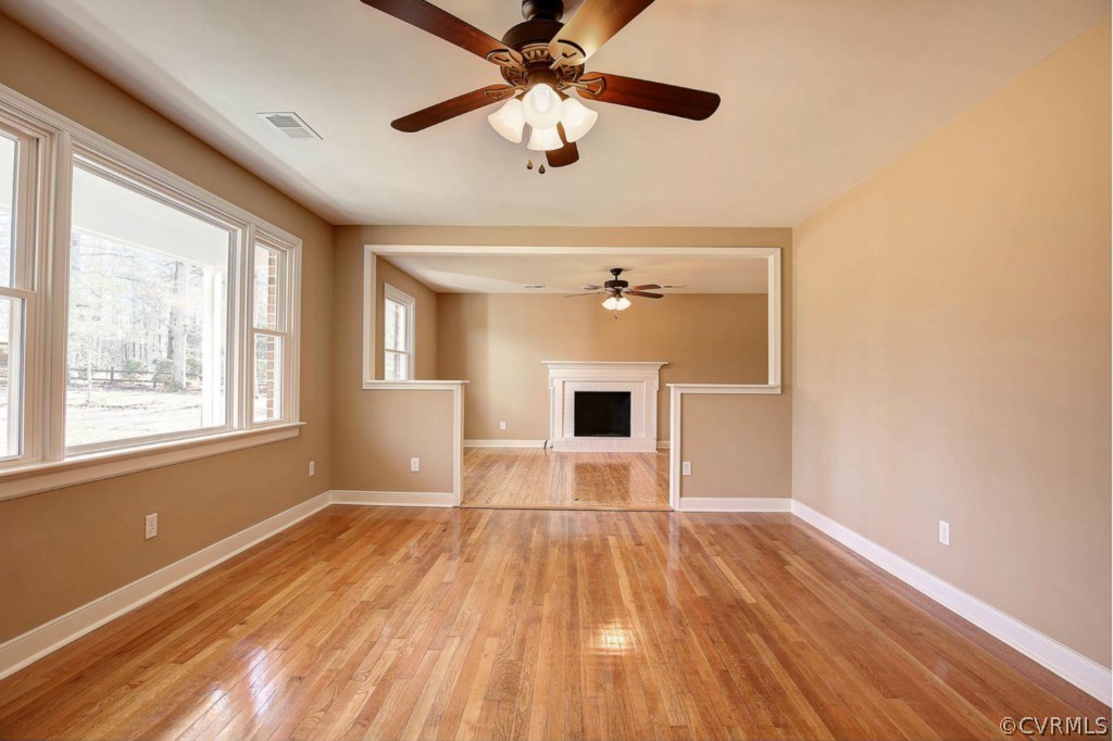 6600 Rock Run Road Chesterfield, VA 23832 - Photo 4 of 24 a view of empty room with wooden floor and fan