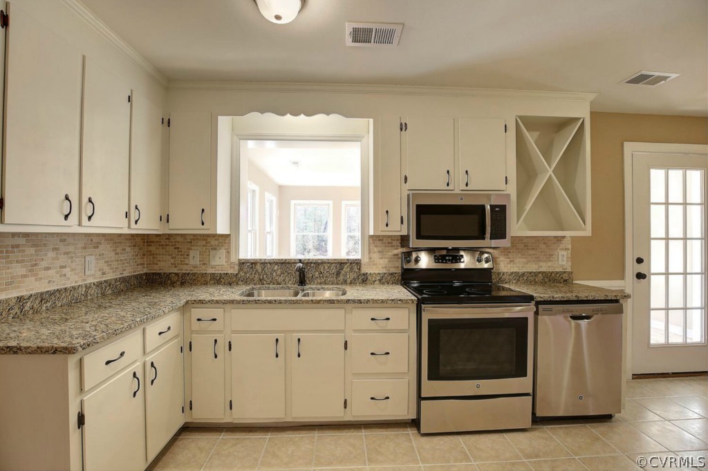 6600 Rock Run Road Chesterfield, VA 23832 - Photo 9 of 24 a kitchen with granite countertop white cabinets and white appliances
