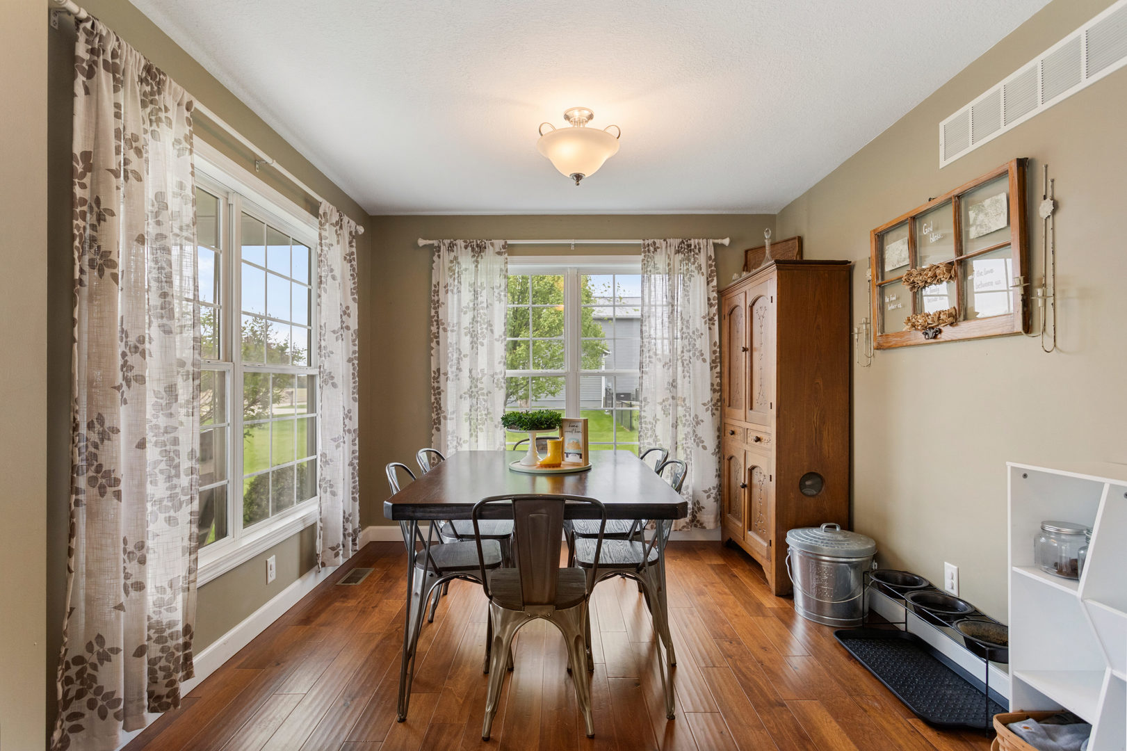 7739 Lakewood Road Weldon, IL 61882 - Photo 7 of 35 a view of a dining room with furniture window and wooden floor