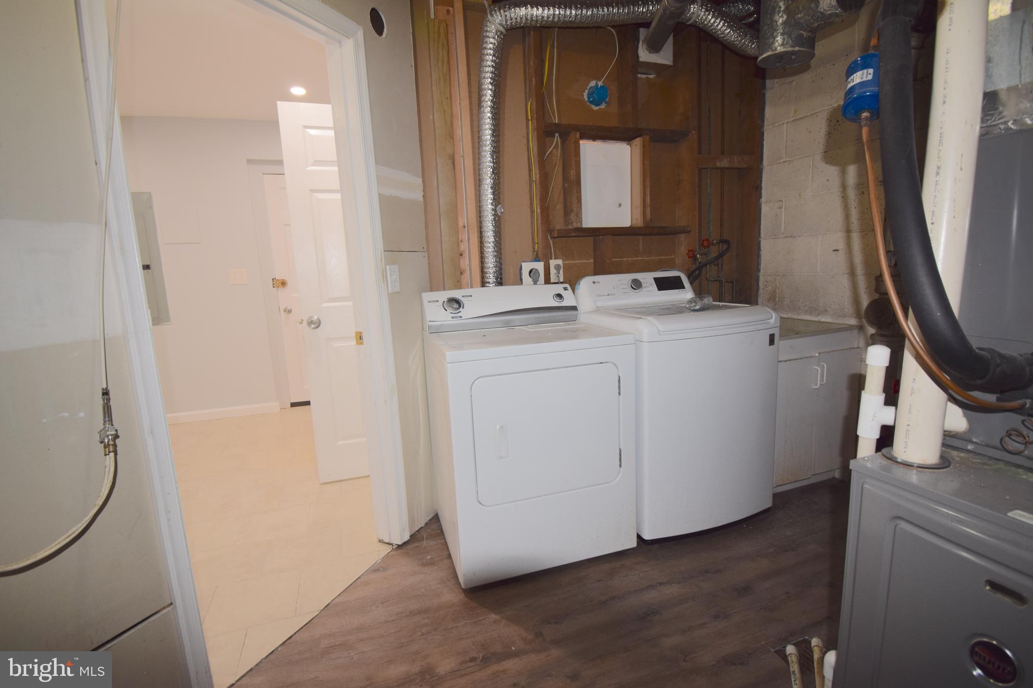 14017 Adkins Road Laurel, MD 20708 - Photo 17 of 19 a bathroom with a sink a toilet and a mirror