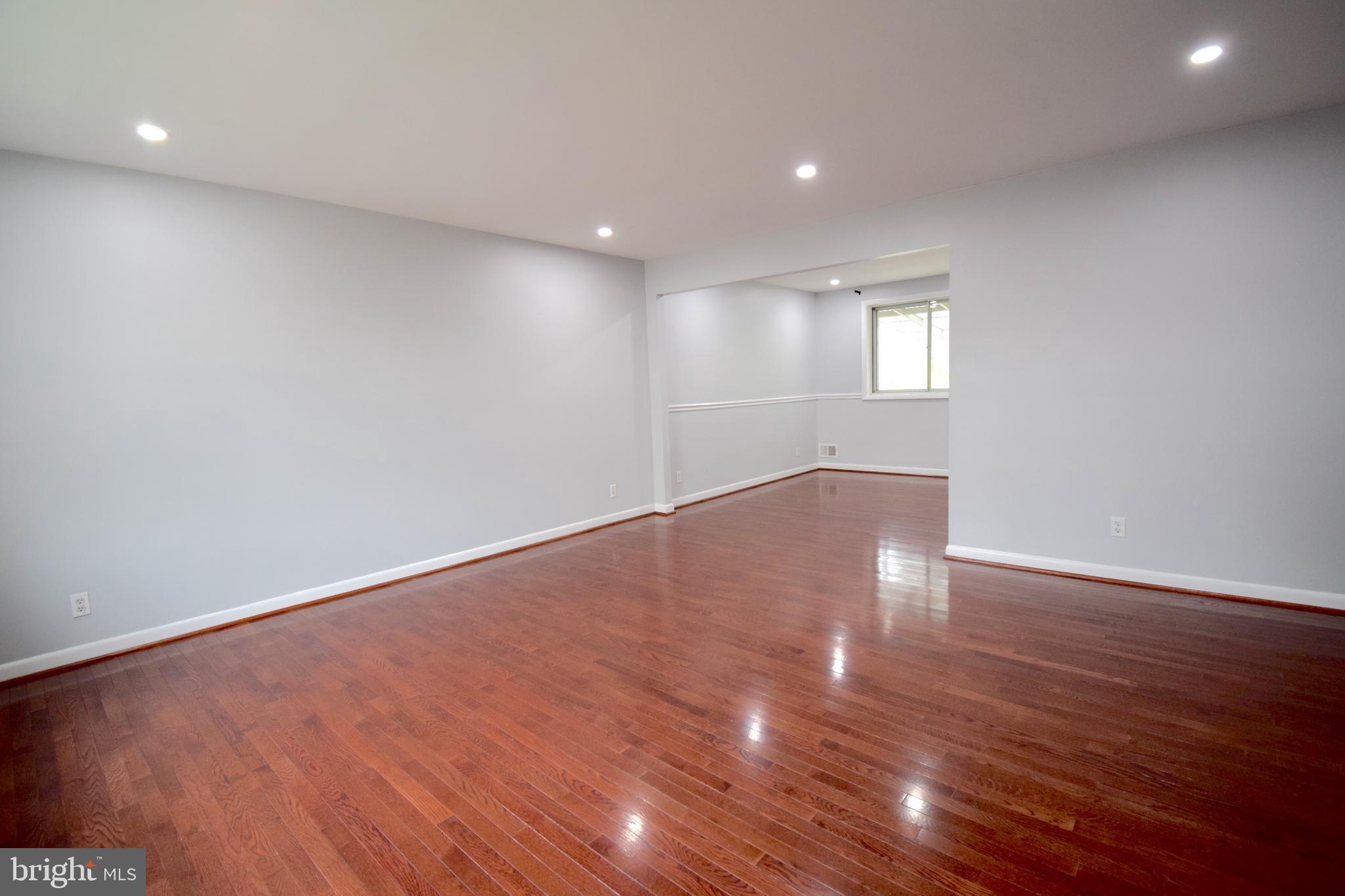 14017 Adkins Road Laurel, MD 20708 - Photo 8 of 19 a view of empty room with wooden floor and fan