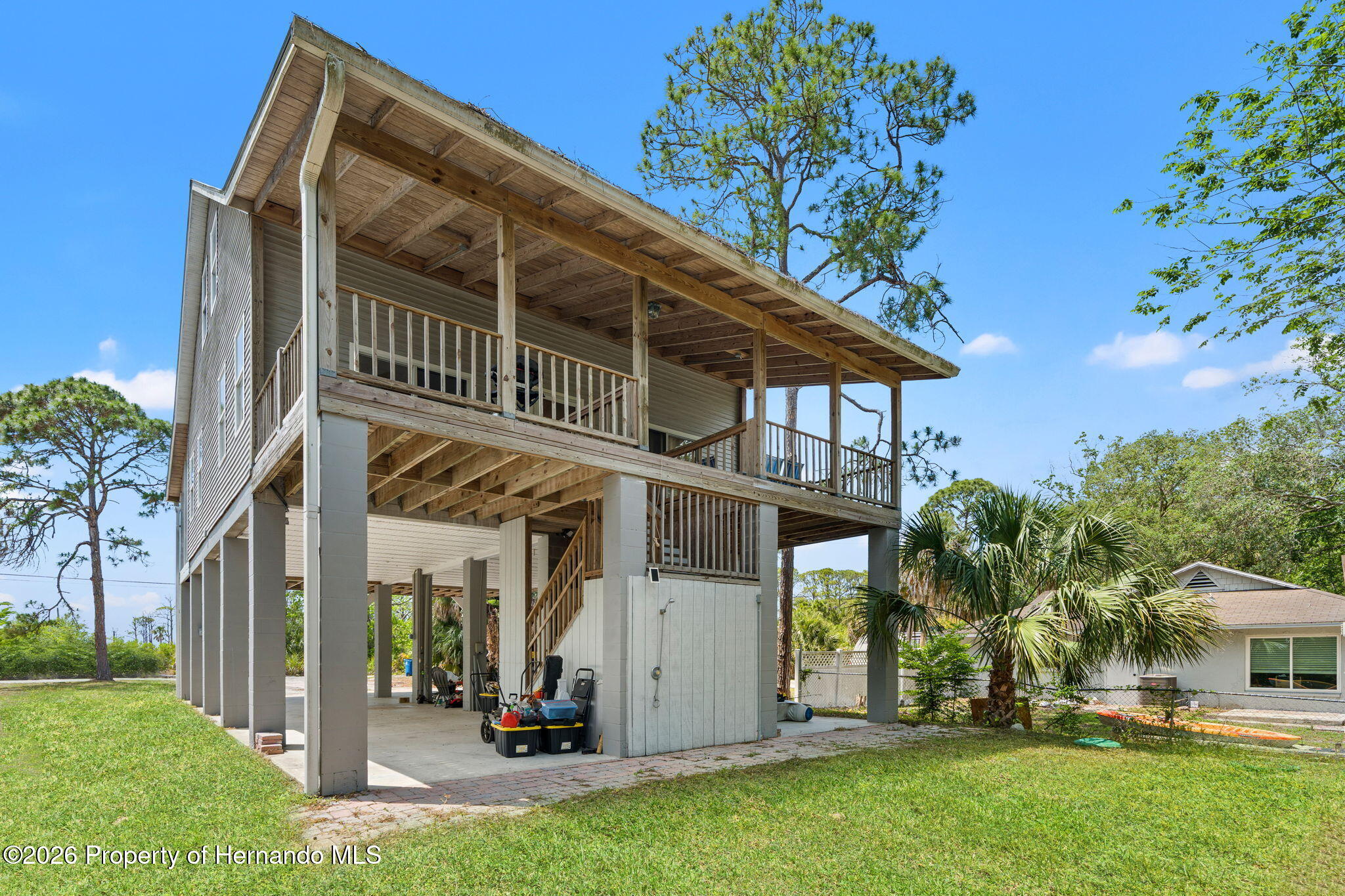 1566 Indian Bay Road Spring Hill, FL 34607 - Photo 3 of 56 front view of house with a yard