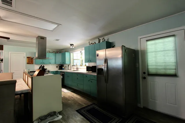 a view of entryway with workspace and wooden floor