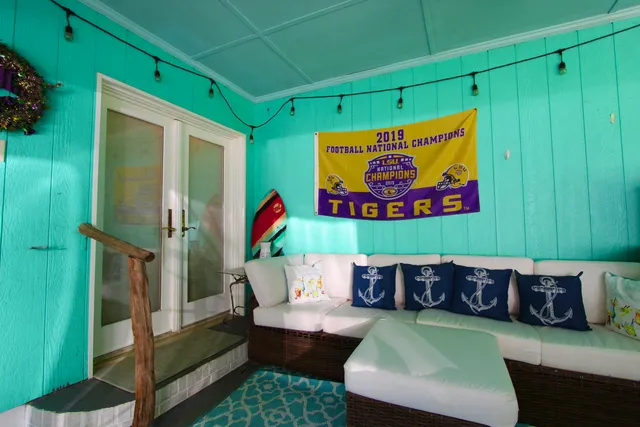 a view of a livingroom with furniture and a floor to ceiling window