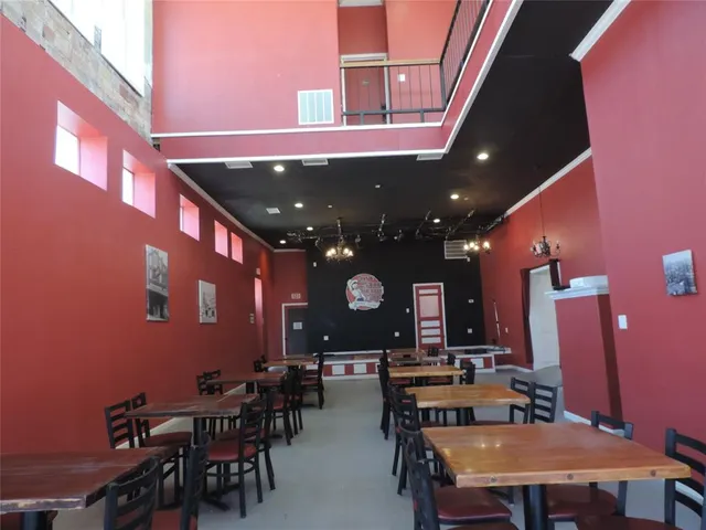 a dinning area with a table and chairs