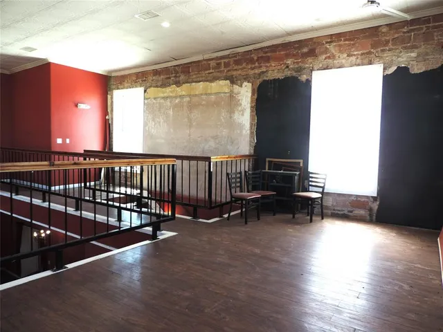 a view of a balcony with chairs