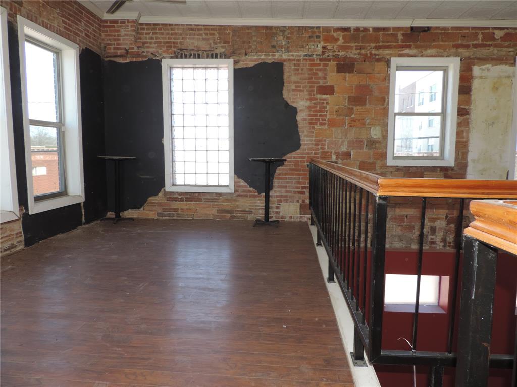 112 South Austin Street Ranger, TX 76470 - Photo 20 of 40 a view of entryway with wooden floor