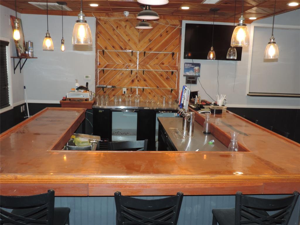 112 South Austin Street Ranger, TX 76470 - Photo 9 of 40 a bathroom with a sink and a mirror