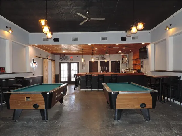 a living room with furniture and a pool