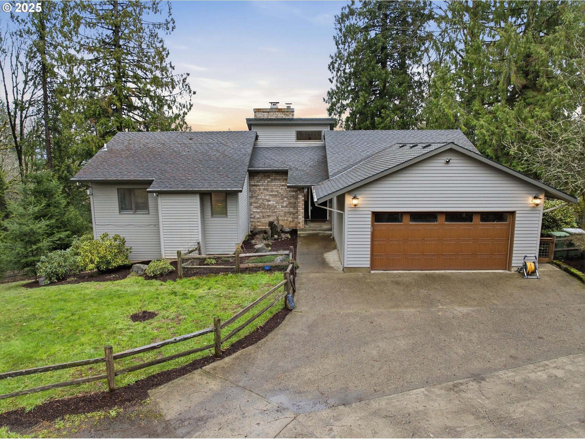 21645 Southwest McCormick Hill Road Hillsboro, OR 97123 - Photo 1 of 47 a front view of a house with a garden and yard