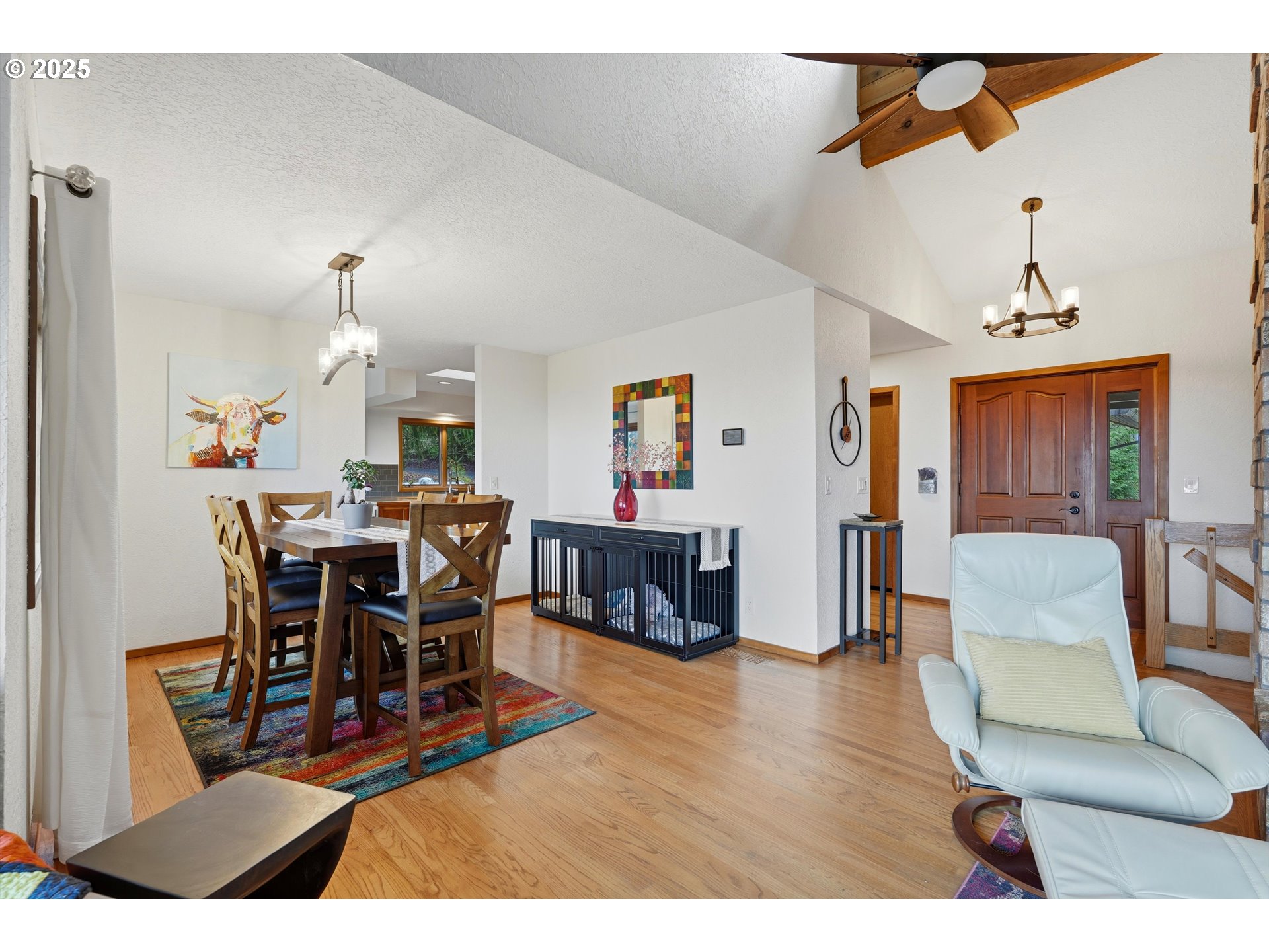 21645 Southwest McCormick Hill Road Hillsboro, OR 97123 - Photo 13 of 47 a living room with furniture a dining table and a chandelier