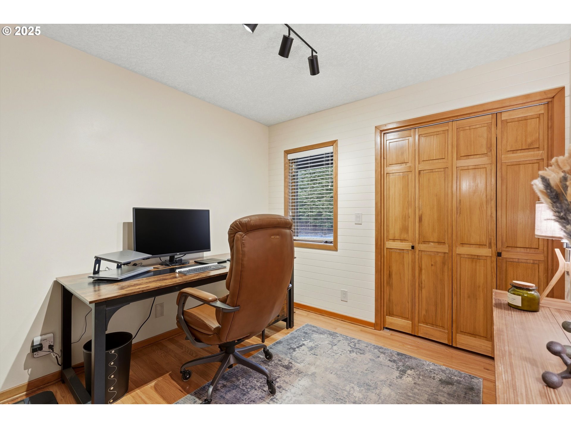 21645 Southwest McCormick Hill Road Hillsboro, OR 97123 - Photo 16 of 47 a view of a workspace with furniture and a window