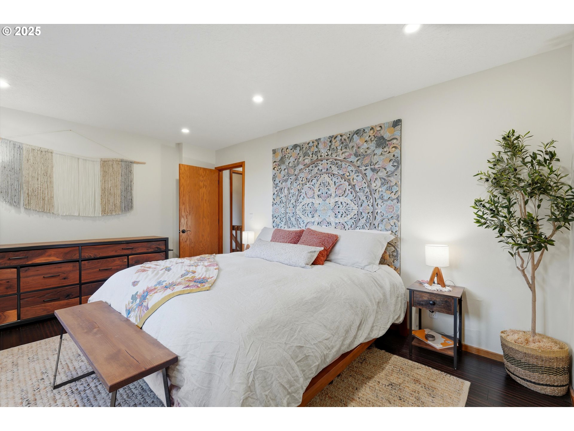21645 Southwest McCormick Hill Road Hillsboro, OR 97123 - Photo 23 of 47 a bedroom with a bed a dresser and potted plant