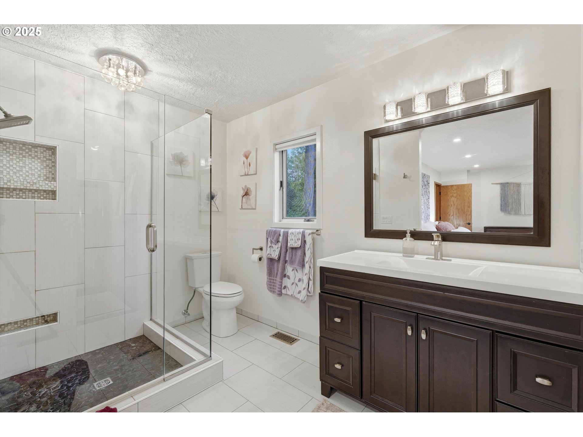 21645 Southwest McCormick Hill Road Hillsboro, OR 97123 - Photo 27 of 47 a bathroom with a granite countertop sink mirror and shower