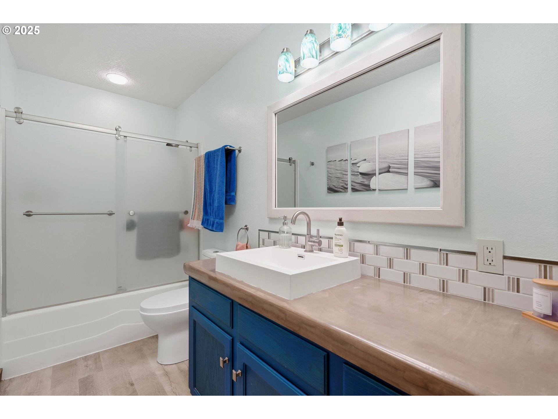 21645 Southwest McCormick Hill Road Hillsboro, OR 97123 - Photo 29 of 47 a bathroom with a sink a toilet and shower