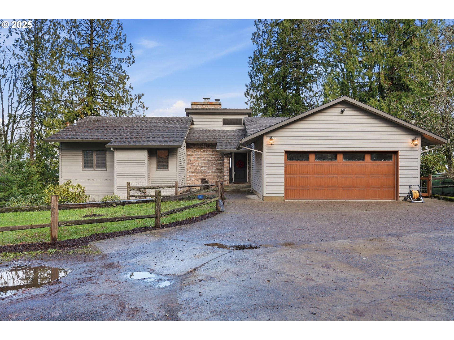 21645 Southwest McCormick Hill Road Hillsboro, OR 97123 - Photo 4 of 47 a front view of a house with a yard and garage