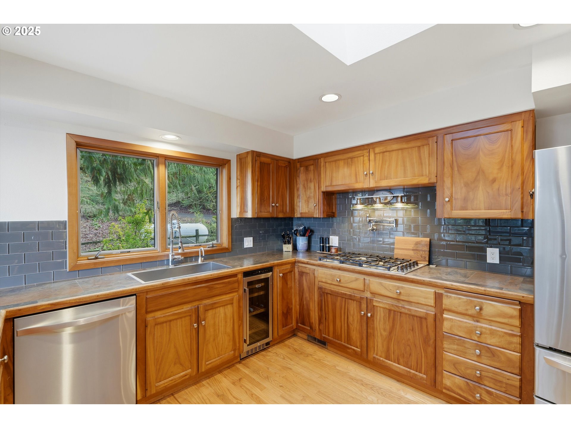 21645 Southwest McCormick Hill Road Hillsboro, OR 97123 - Photo 10 of 47 a kitchen with a sink stove and cabinets