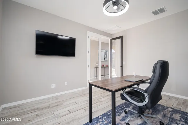a view of a workspace with furniture
