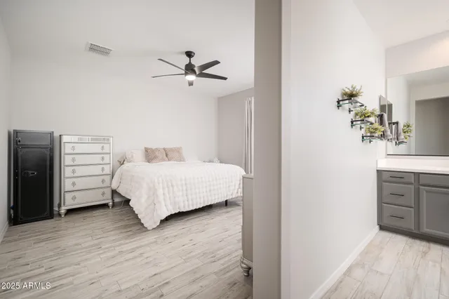 a bedroom with a bed and a dresser