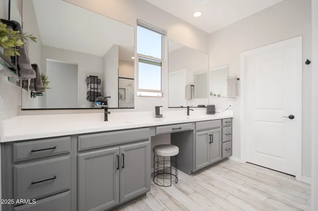 a spacious bathroom with a double vanity sink mirror and