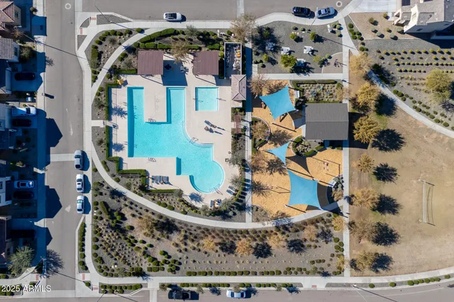 an aerial view of a house with a swimming pool