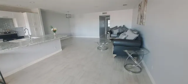 a living room with furniture and a couch