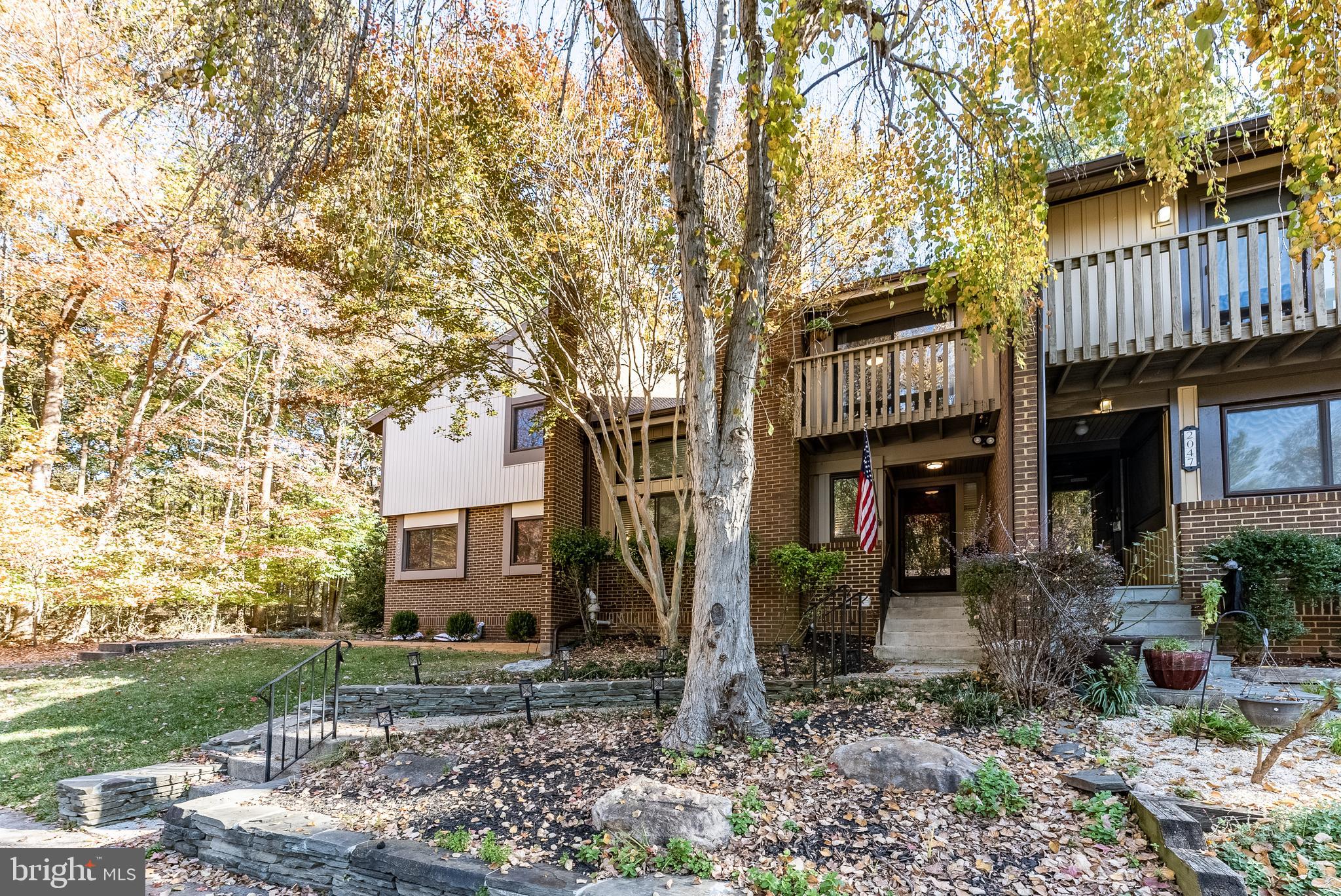 2045 Winged Foot Court Reston, VA 20191 - Photo 21 of 39 a view of a house with a yard and a tree