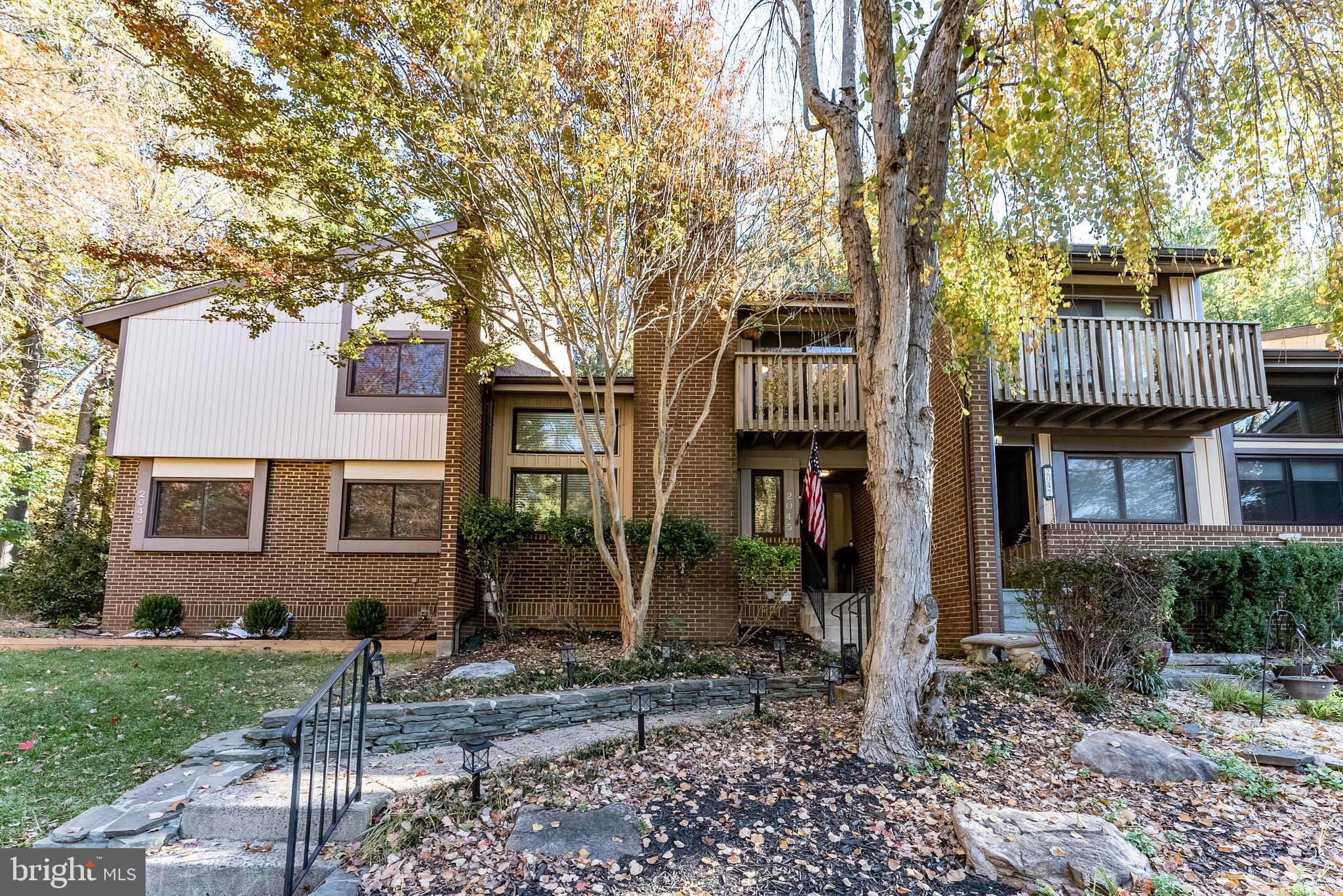 2045 Winged Foot Court Reston, VA 20191 - Photo 22 of 39 a front view of a house with garden
