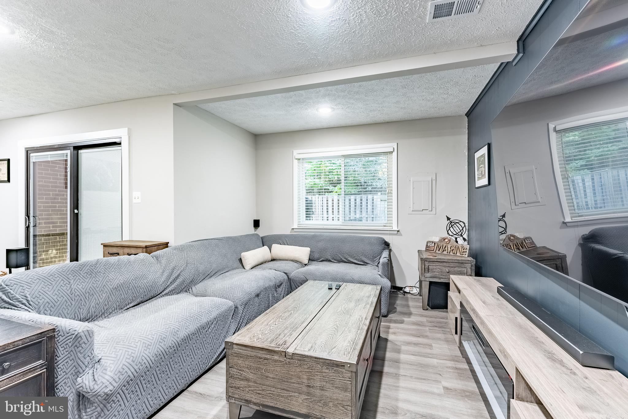 2045 Winged Foot Court Reston, VA 20191 - Photo 23 of 39 a living room with furniture and a large window