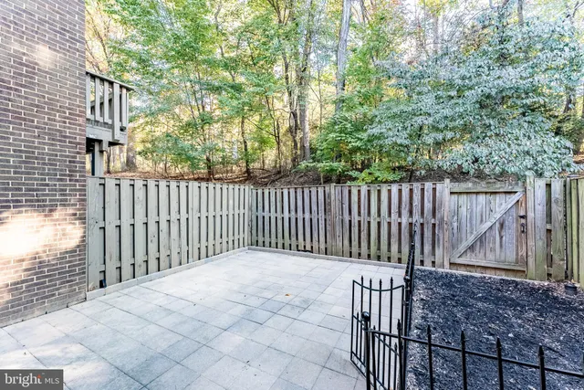 a view of deck and wooden fence