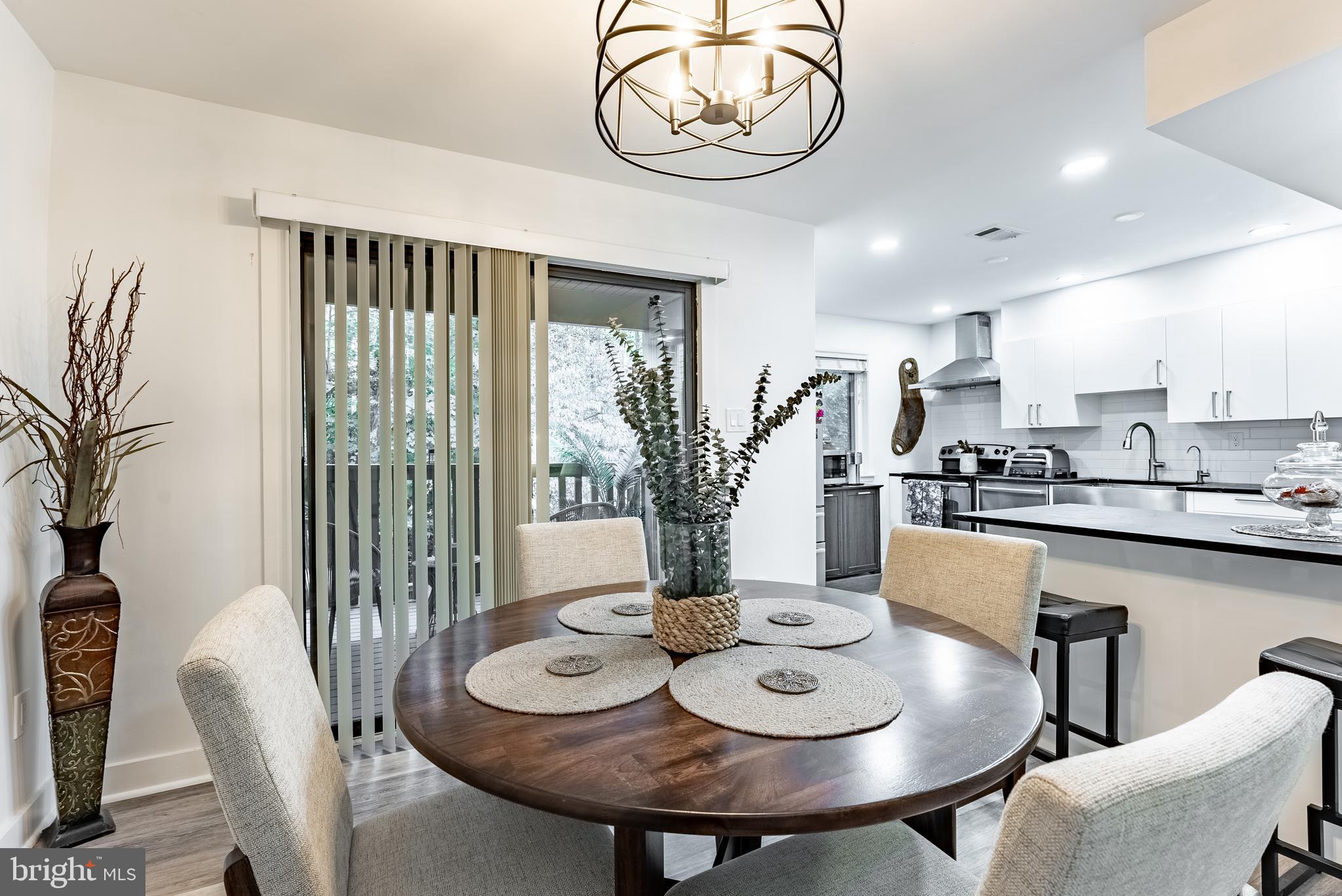 2045 Winged Foot Court Reston, VA 20191 - Photo 28 of 39 a view of a dining room with furniture window and wooden floor