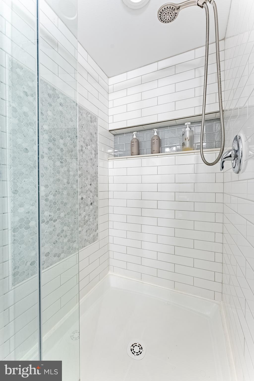 2045 Winged Foot Court Reston, VA 20191 - Photo 37 of 39 a bathroom with a bathtub and shower