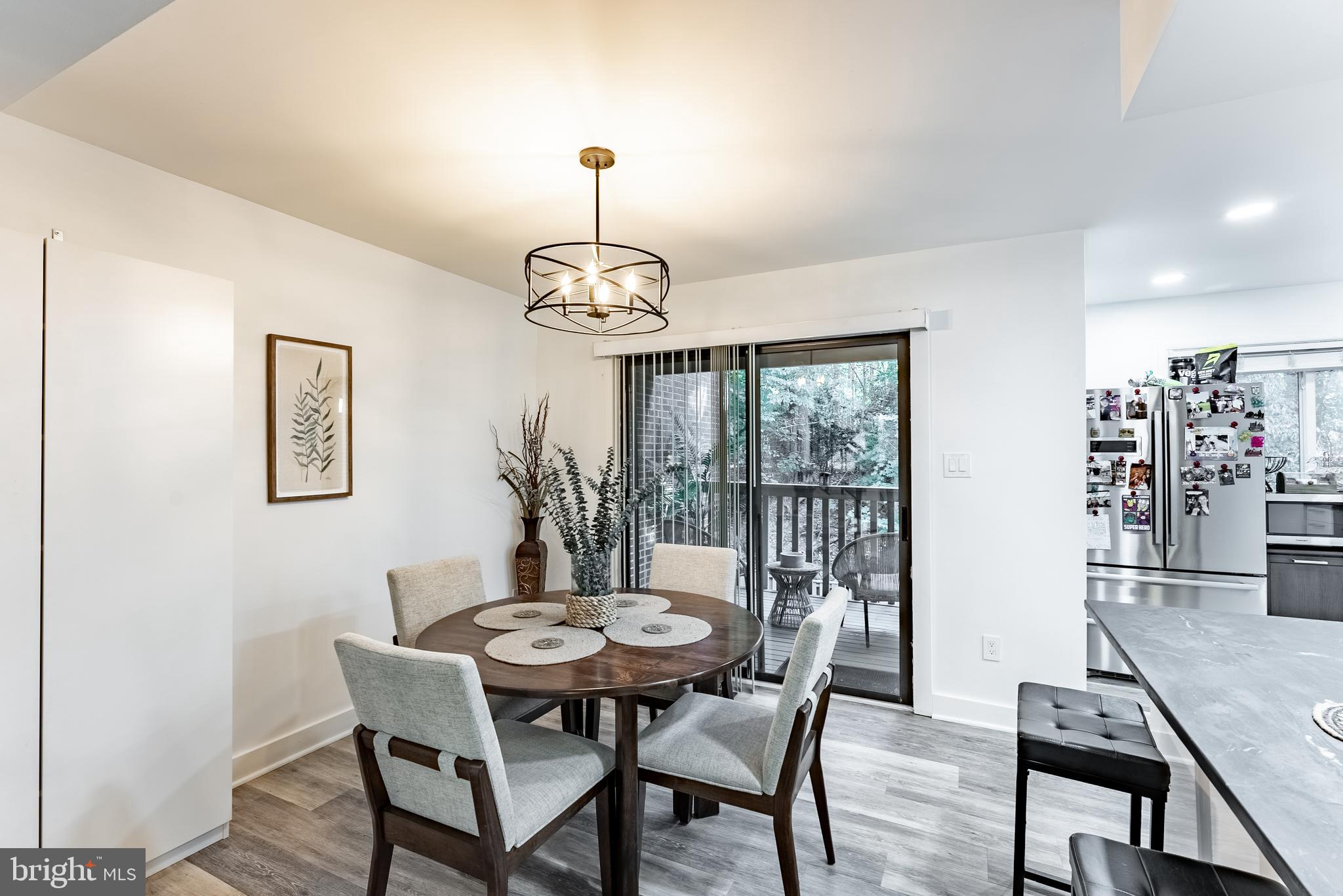 2045 Winged Foot Court Reston, VA 20191 - Photo 4 of 39 a view of a dining room with furniture and chandelier