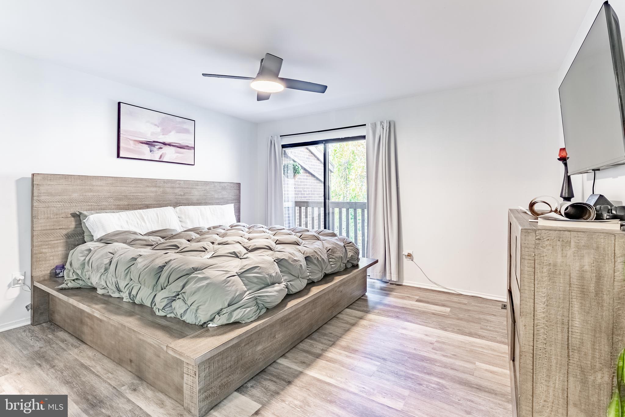 2045 Winged Foot Court Reston, VA 20191 - Photo 9 of 39 a bed sitting in a bedroom next to a window