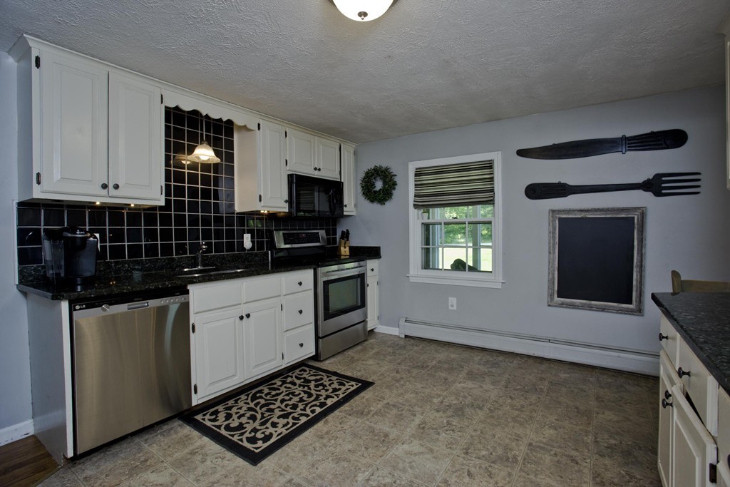 2 Sunset Rock Road Wilbraham, MA 01095 - Photo 3 of 30 a kitchen with granite countertop a stove a sink and a microwave